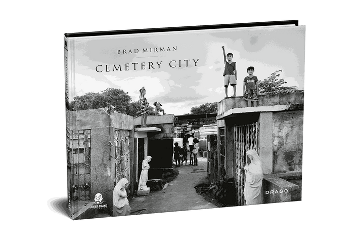 Cemetery City book cover by Brad Mirman showing black and white photo of children in Manila cemetery community