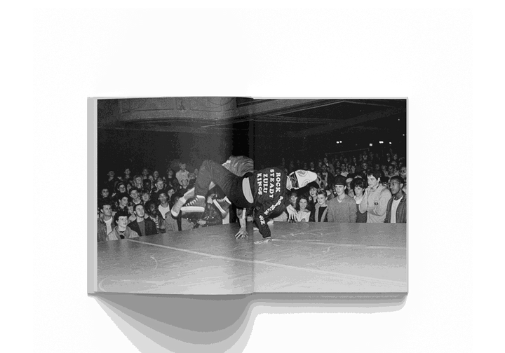 Janette Beckman photography book featuring black and white image of a breakdancer performing in front of a crowd