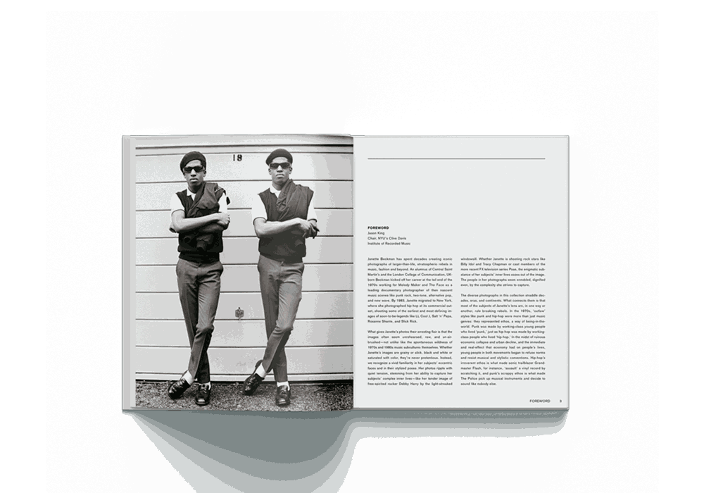 Janette Beckman Rebels From Punk to Dior first edition photography book open to black and white image of two men crossing arms and text on right page