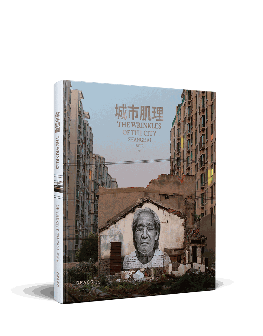 Cover of JR's Wrinkles Of The City Shanghai featuring elderly portrait mural on urban wall