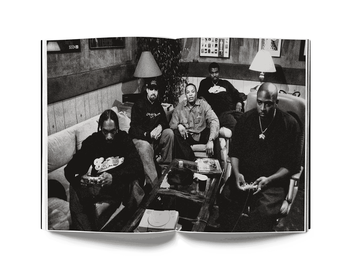 Estevan Oriol black and white photo of five men sitting indoors featured in This is Los Angeles book