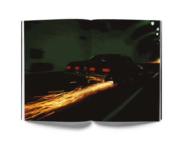 Estevan Oriol photograph of car with sparks trailing in dark tunnel from This is Los Angeles book