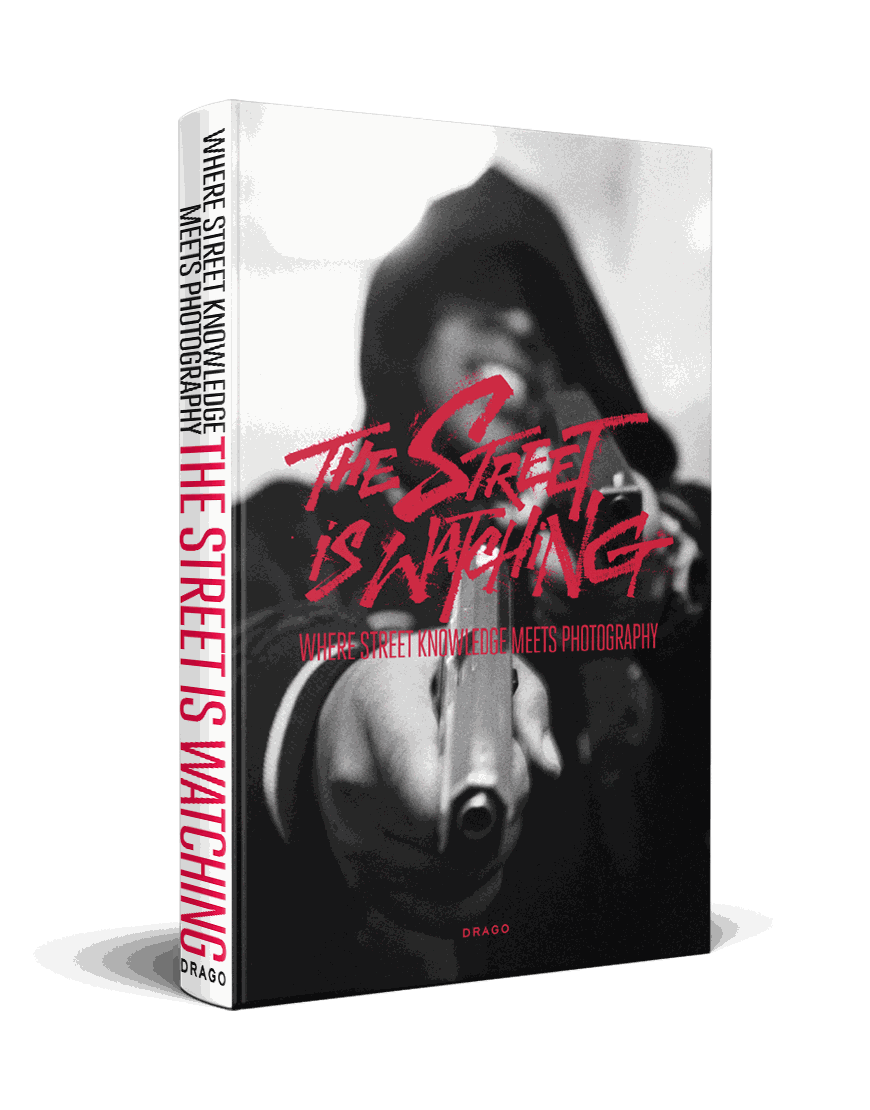 The Street is Watching street photography book cover with blurred black and white image and red title text