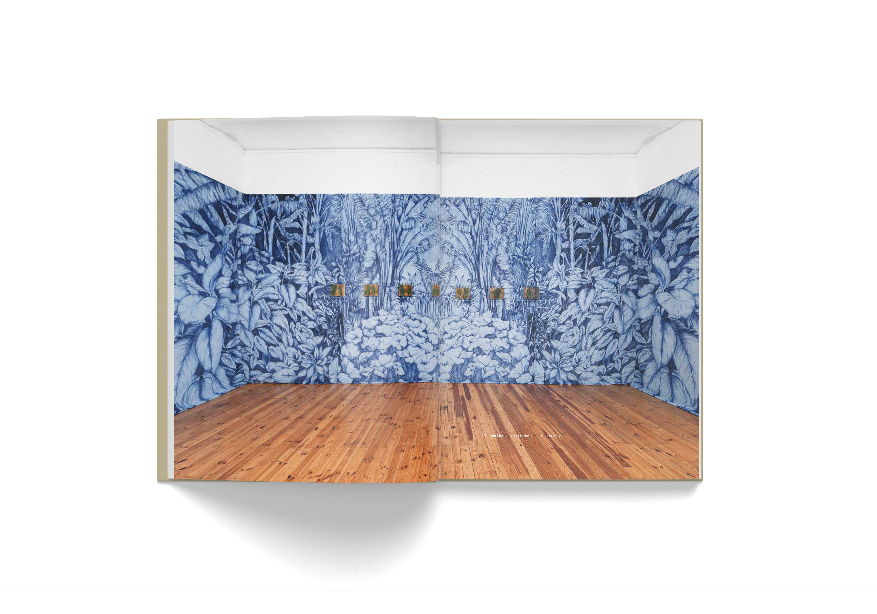 Pietro Ruffo art book spread featuring blue botanical wall mural and wooden floor