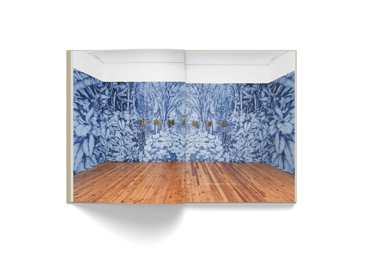 Pietro Ruffo art book spread featuring blue botanical wall mural and wooden floor