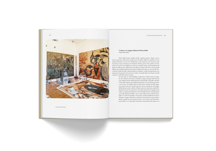 Open book showing Pietro Ruffo's artwork and an essay from "L'Ultimo Meraviglioso Minuto" exhibition catalogue