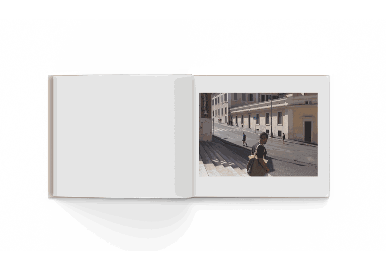 Open photo book "Rome 10/20" by Mohamed Keita featuring street scene with people and buildings in Rome