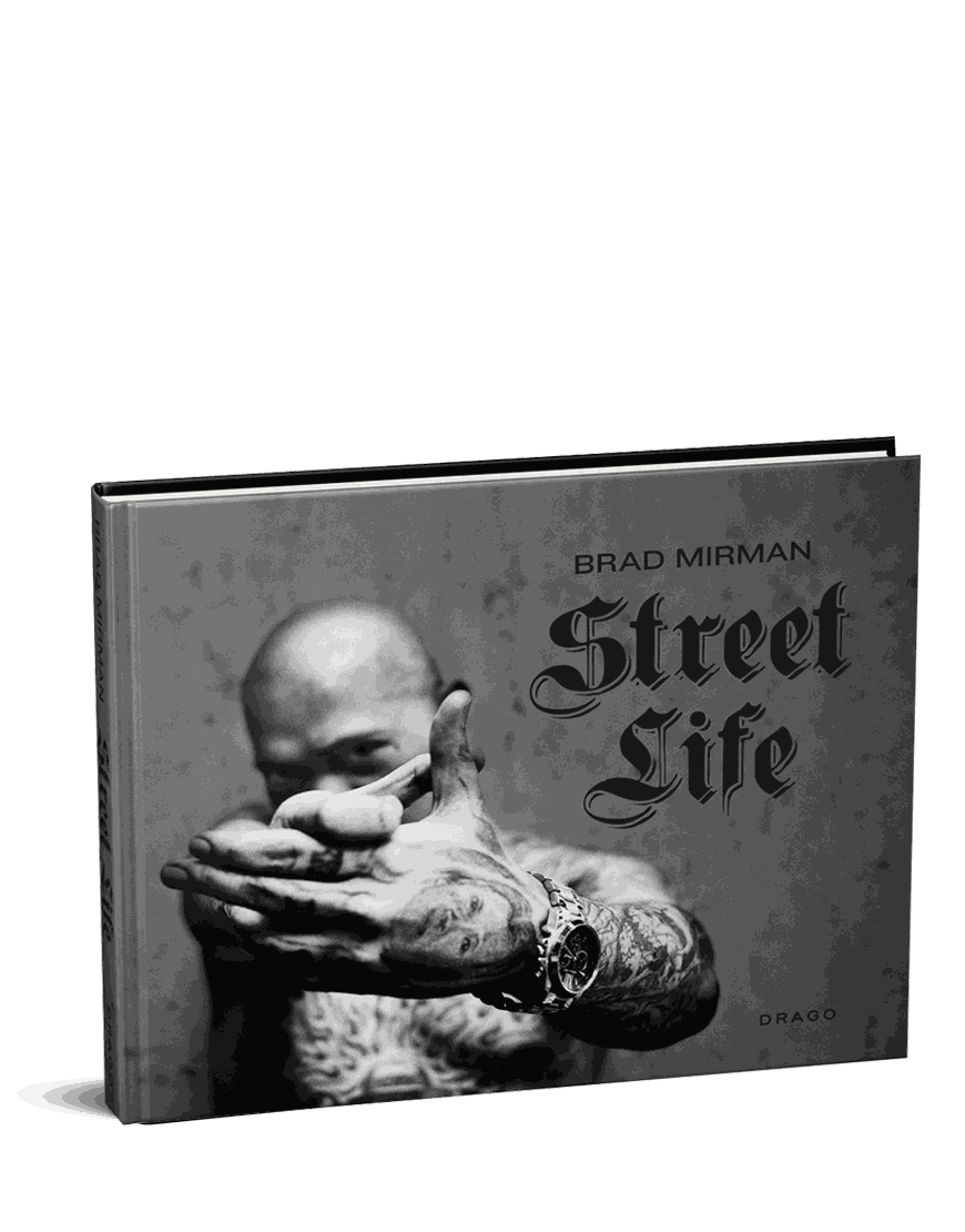 Brad Mirman Street Life book cover featuring a tattooed man with outstretched hands in black and white