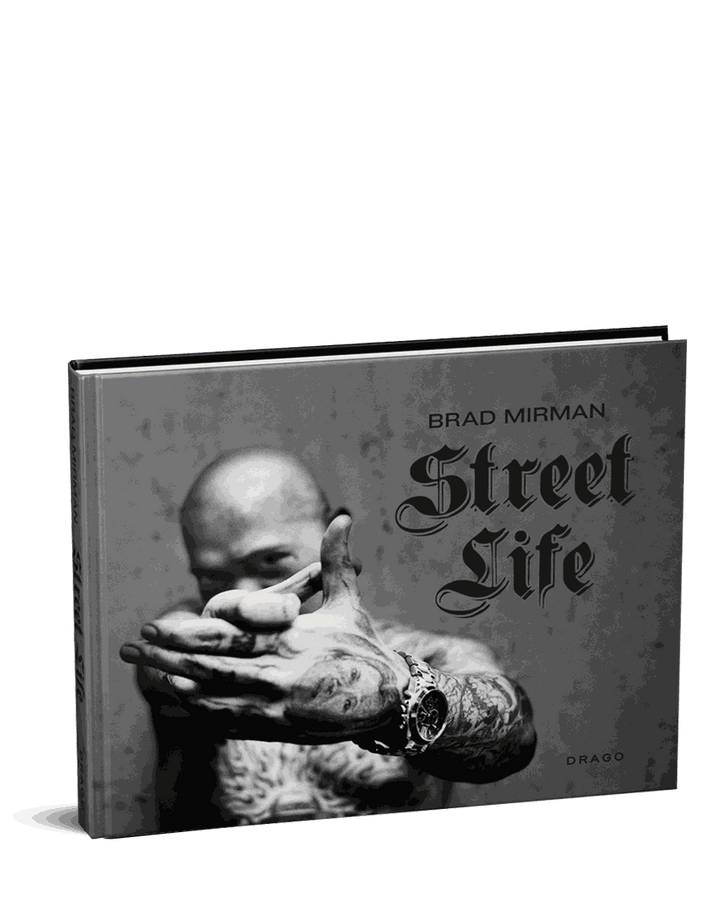 Brad Mirman Street Life book cover featuring a tattooed man with outstretched hands in black and white